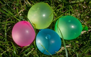 Why Do Balloons Pop When They Touch Grass? Science 2026