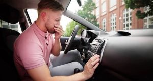 Why Does My Car Smell Like Burning Oil? Warning Signs 2026